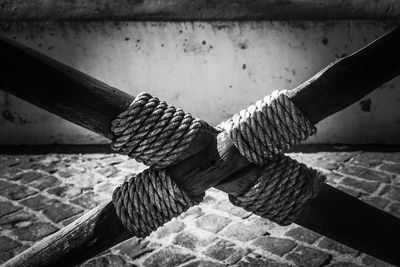 Close-up of rope tied on wood