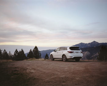 Car on field against sky