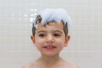 Portrait of cute boy in bathroom at home