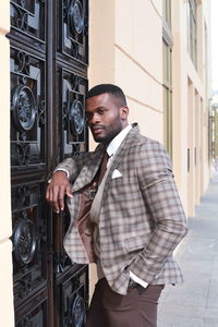 Businessman standing outside building