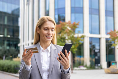 Young woman using mobile phone