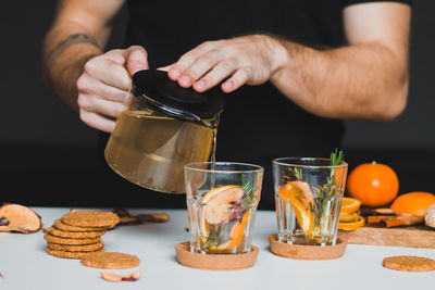 Midsection of man preparing food