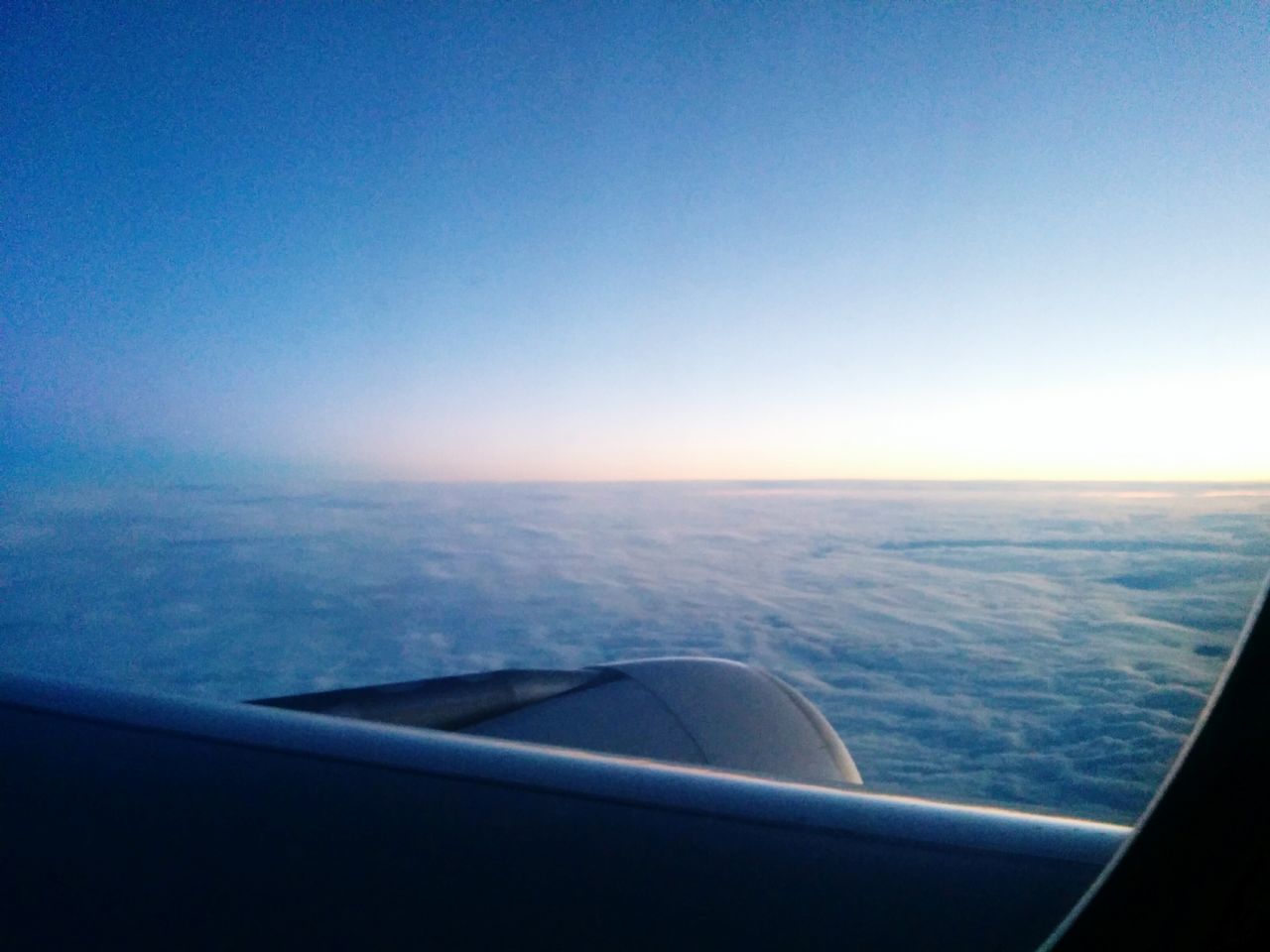 transportation, flying, nature, blue, mode of transport, airplane, aerial view, travel, mid-air, vehicle interior, aircraft wing, clear sky, air vehicle, window, scenics, beauty in nature, journey, sea, sky, no people, day, water, outdoors, airplane wing