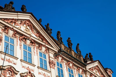 Low angle view of historic building against blue sky