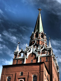 Low angle view of building against cloudy sky