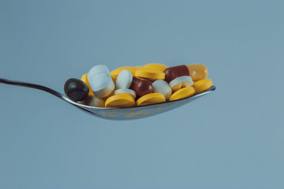 Close-up of candies against blue background