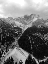 Aerial view of snowcapped mountains against sky