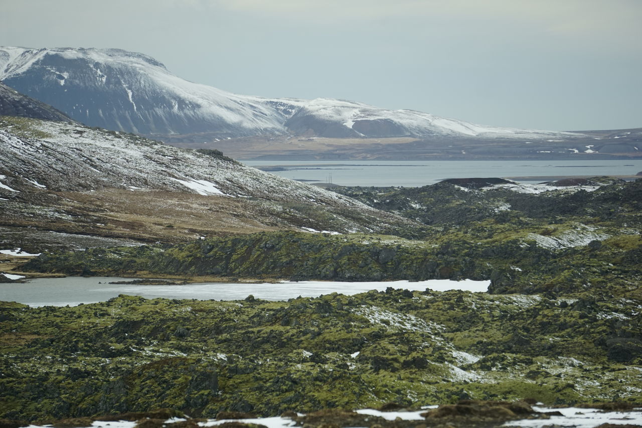 SCENIC VIEW OF MOUNTAINS AND LAKE AGAINST SKY