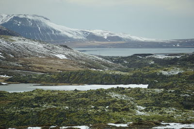 Scenic view of snowcapped mountains against sky