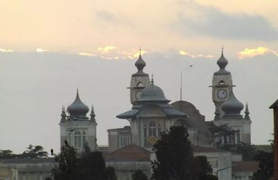Built structure against sky at sunset