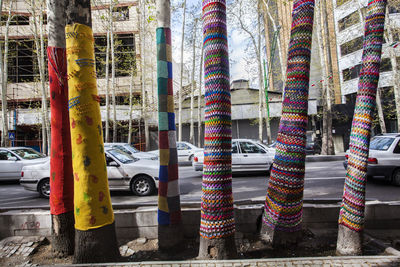 Multi colored cars on street in city