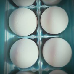 Directly above shot of eggs in container