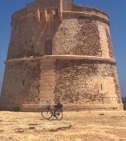 Low angle view of bicycle parked on building