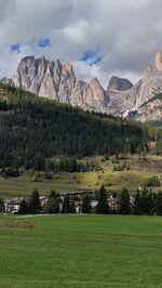 Scenic view of landscape and mountains against sky