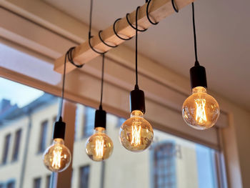 Low angle view of illuminated light bulb