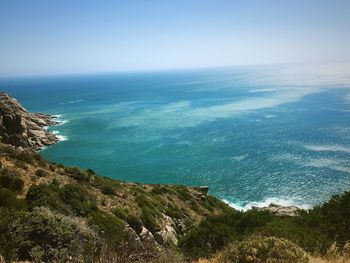 Scenic view of sea against clear blue sky