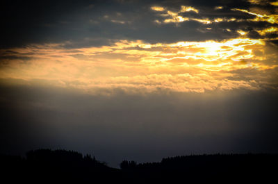 Silhouette of trees against sky during sunset