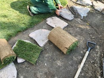 High angle view of man working on grass