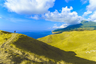 Scenic view of sea against cloudy sky