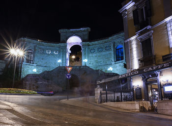 Illuminated buildings in city at night