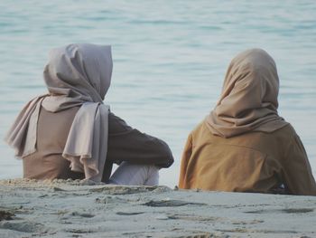 Rear view of women on shore