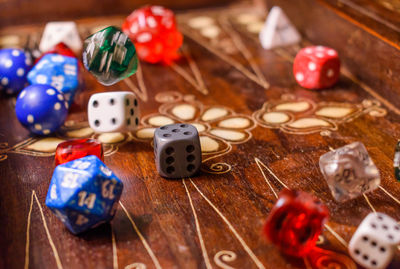 Close-up of dices on wooden table