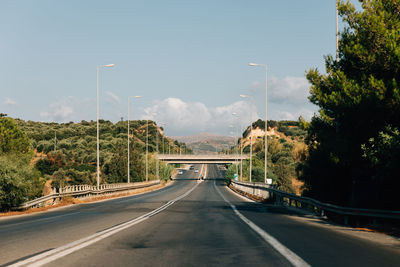 Empty road against sky