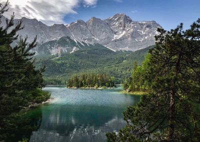 Scenic view of lake and mountains against sky