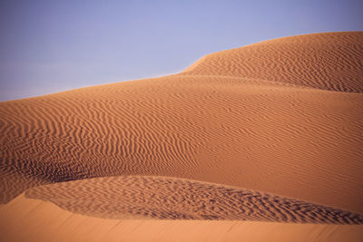 Scenic view of desert against clear sky