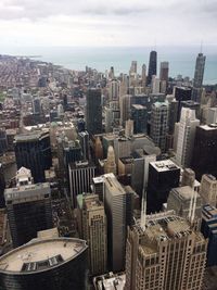 High angle view of buildings in city against sky