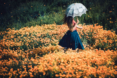 Woman standing in field