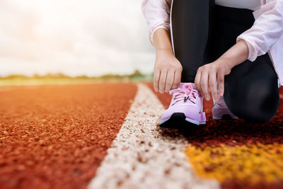 Low section of man running on floor