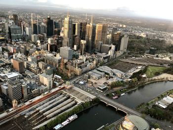 High angle view of modern buildings in city against sky