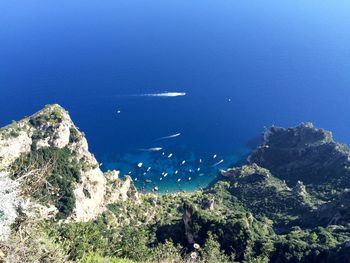 High angle view of sea against blue sky