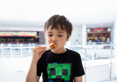 Portrait of boy holding ice cream