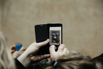 Man photographing with mobile phone