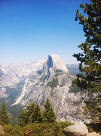 Scenic view of mountains against clear blue sky