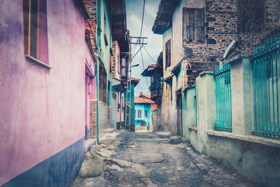 Narrow alley amidst buildings in town