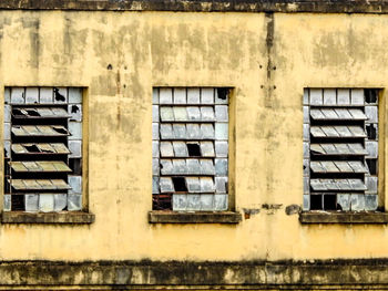 Damaged glass window in building