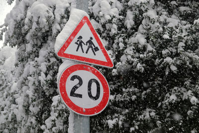 Close-up of road sign on snow