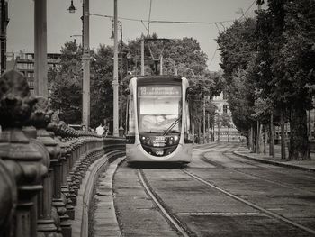 Train on railroad track against sky