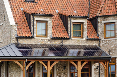House built in traditional architecture, with solar panels as an exception