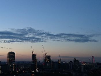 Cityscape against sky at dusk