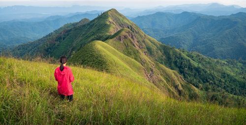 Rear view of woman looking at mountains