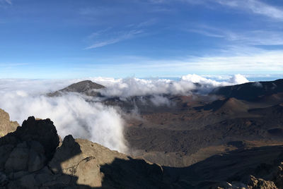 Scenic view of volcanic mountain range against sky