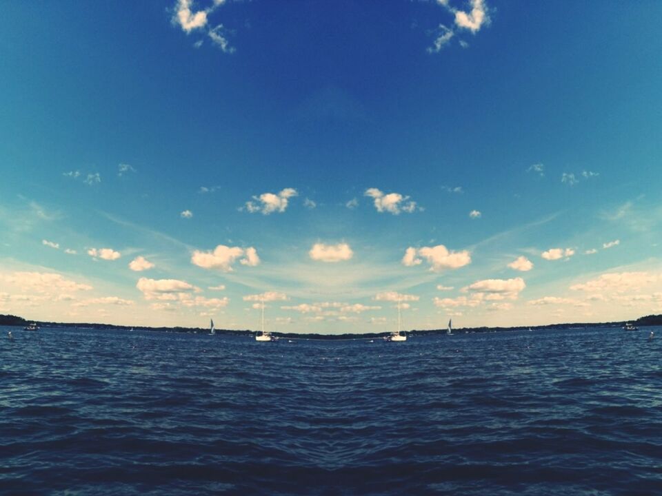 water, sea, waterfront, sky, blue, tranquil scene, tranquility, rippled, scenics, nautical vessel, horizon over water, beauty in nature, transportation, nature, boat, cloud - sky, cloud, mode of transport, idyllic, seascape