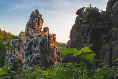 Low angle view of rock formation against sky