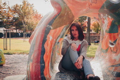 Portrait of young woman sitting