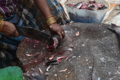 Midsection of man preparing food