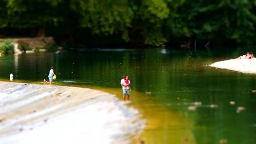 Reflection of woman in lake